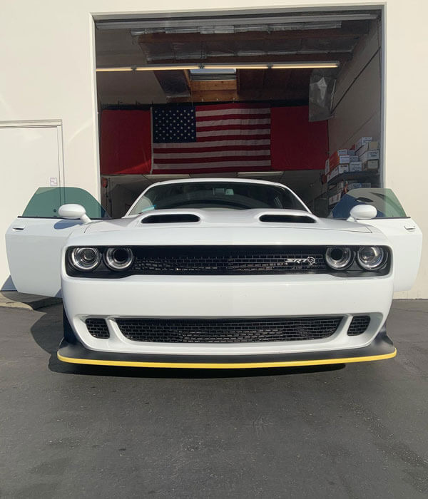 window tint on white sports car with doors open